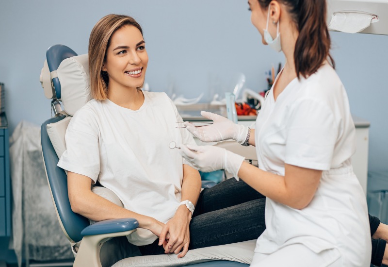 General dentistry dentist consulting patient in dental chair in Antioch, IL
