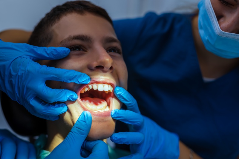 Dental checkup in Antioch, IL with patient and dentist examining crooked teeth