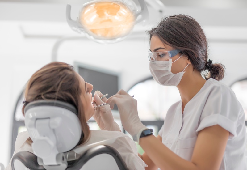 Dentist performing dental filling treatment in Antioch, IL