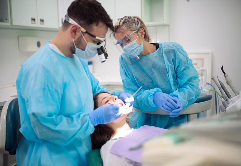 Dentists conducting a dental procedure at Antioch Advanced Dentistry in Antioch, IL