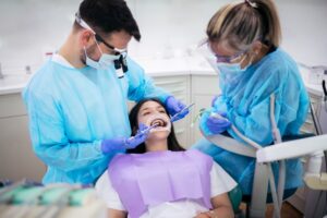 Dental bridge procedure with patient and dentists in clinic in Antioch, IL