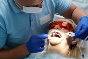 Dentist performing dental sealants procedure in Antioch, IL