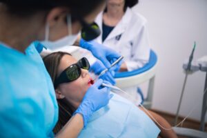 Dentist performing laser gum contouring treatment in Antioch, IL
